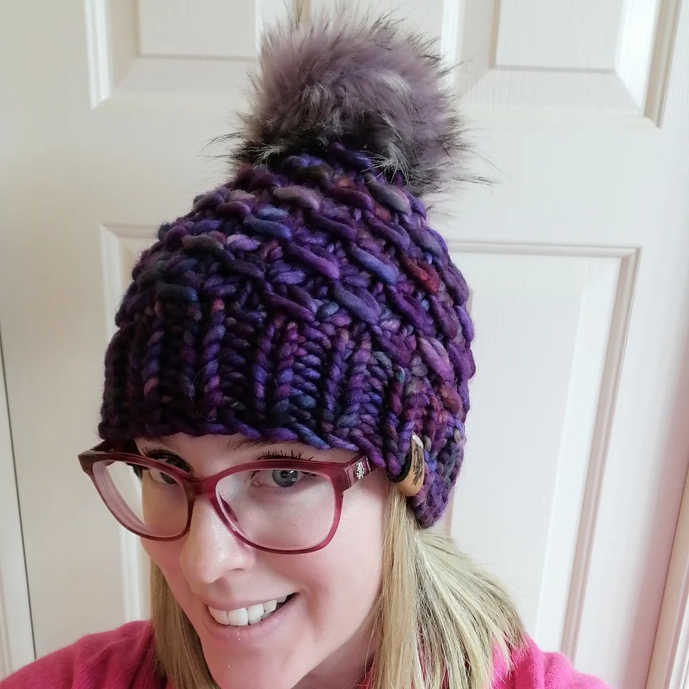 Hand knit merino wool beanie hat with faux fur pom pom